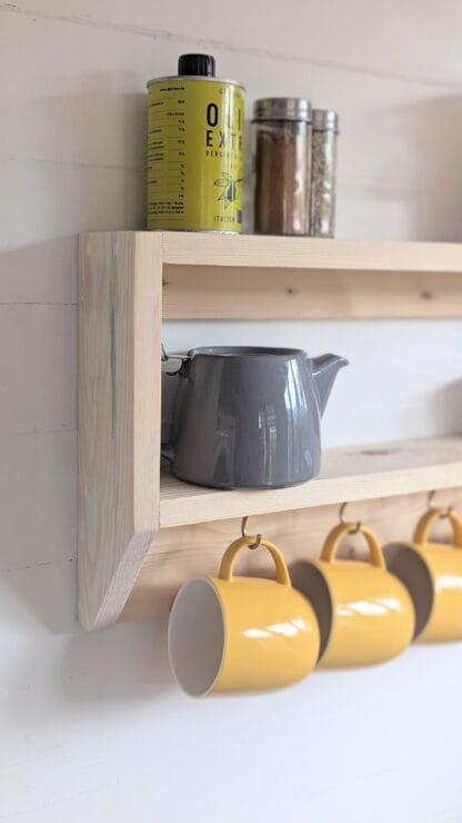 rustic reclaimed wooden kitchen mug shelf.