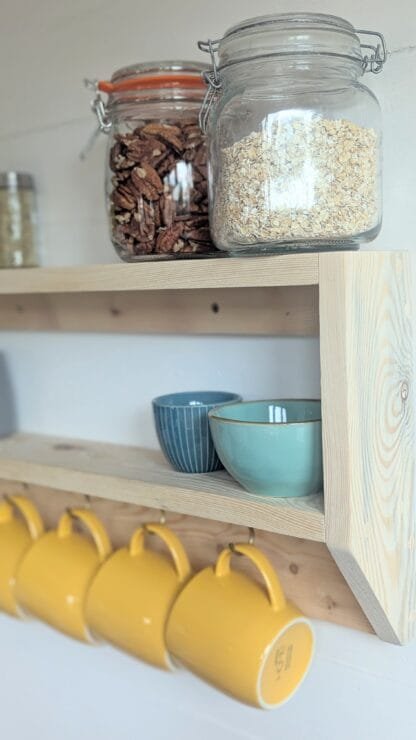 rustic reclaimed wooden kitchen mug shelf.