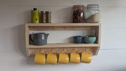 rustic reclaimed wooden kitchen mug shelf.