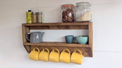 rustic reclaimed wooden kitchen mug shelf.