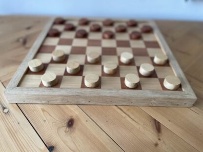 Handmade draughts set made of reclaimed hardwoods by crowfoot salvage